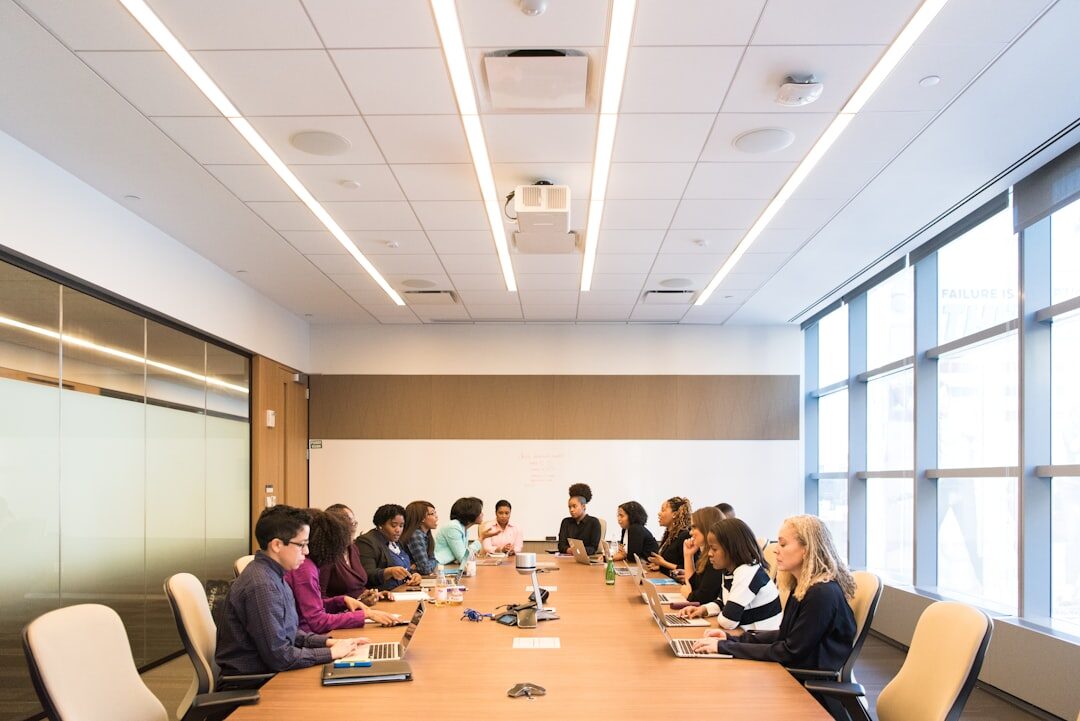 Diverse team of professionals collaborating around a table in a modern meeting room